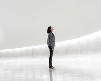 woman by curved wall